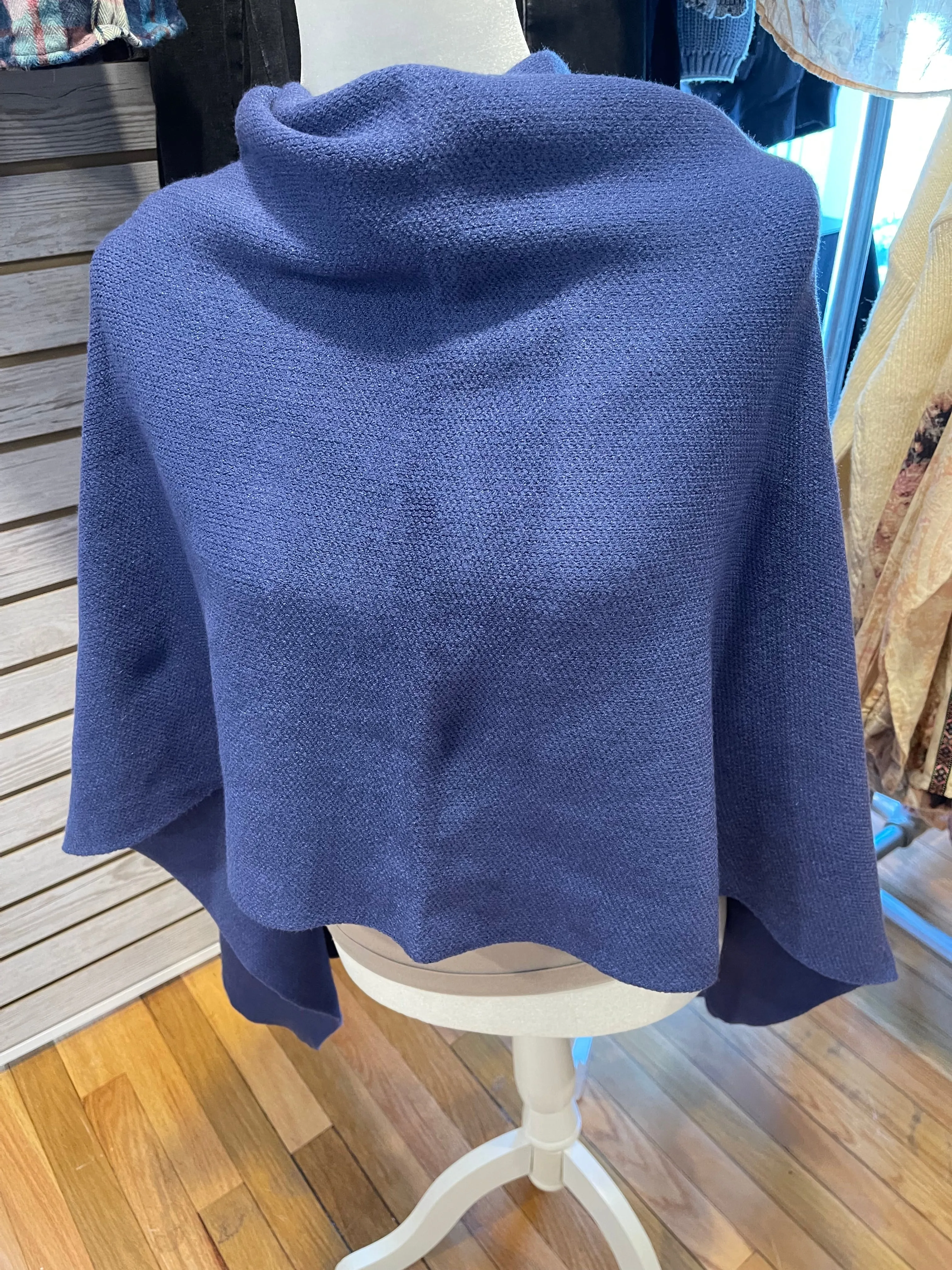 Certainly! Here is an optimized version of the product title with modifiers:

Cozy Cape Cod Knit Poncho for Women - Warm, Stylish, and Versatile Layering Piece

This version includes descriptive adjectives to attract potential buyers.