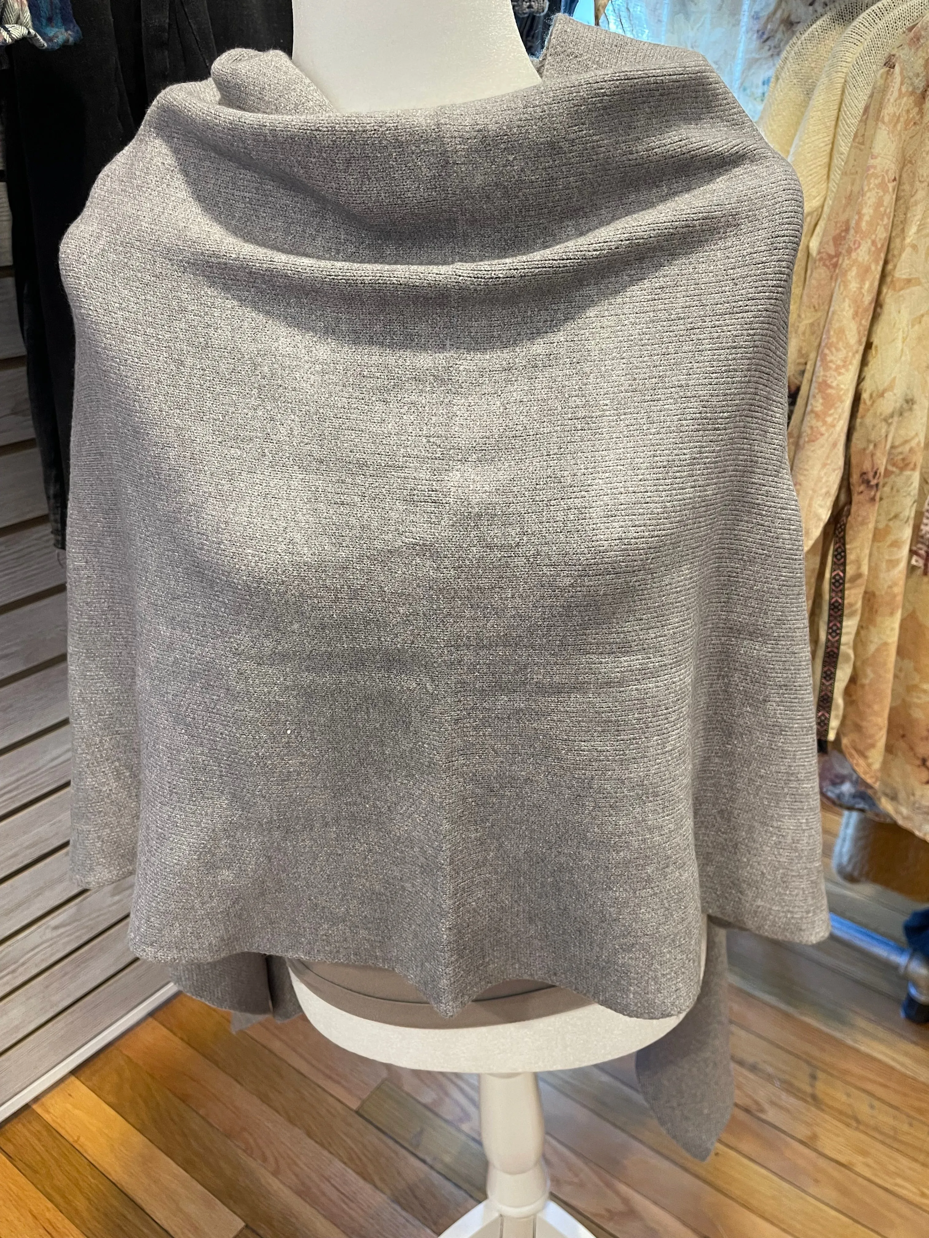 Certainly! Here is an optimized version of the product title with modifiers:

Cozy Cape Cod Knit Poncho for Women - Warm, Stylish, and Versatile Layering Piece

This version includes descriptive adjectives to attract potential buyers.